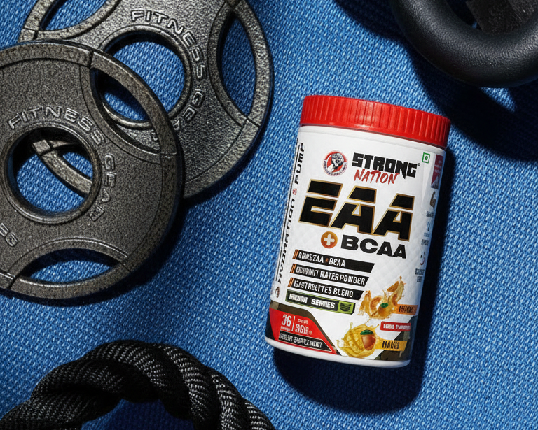 Supplement container labeled 'Strong EAA BCAA' on a blue mat with fitness equipment.